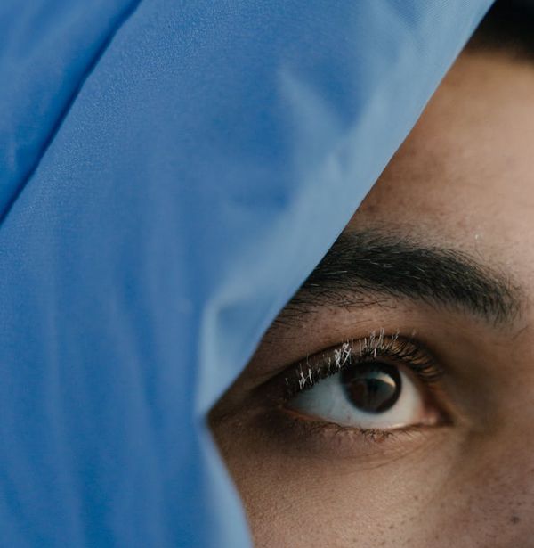 A person looking into the distance with a clear, focused gaze.