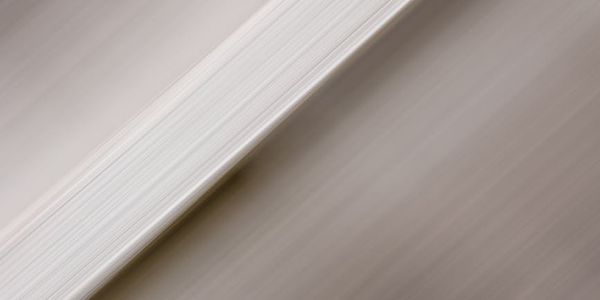 Abstract smooth lines representing gentle eye movement.